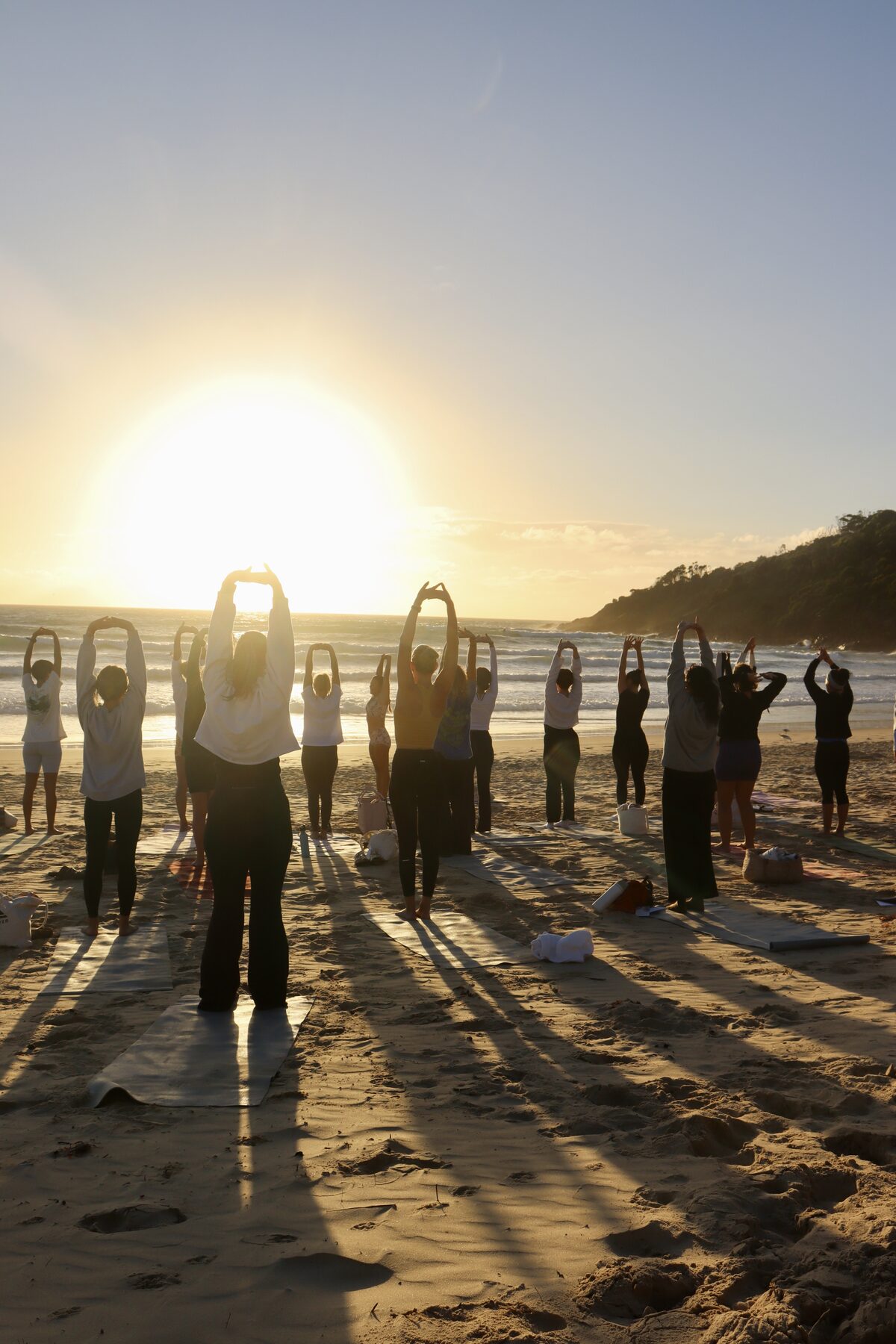 Sunset beach yoga during a Sea Si-Star retreat at One Mile Beach